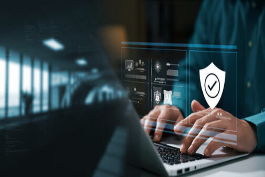 Person typing on laptop with digital security icons overlay – privacy and data protection policy Perth Pickers

